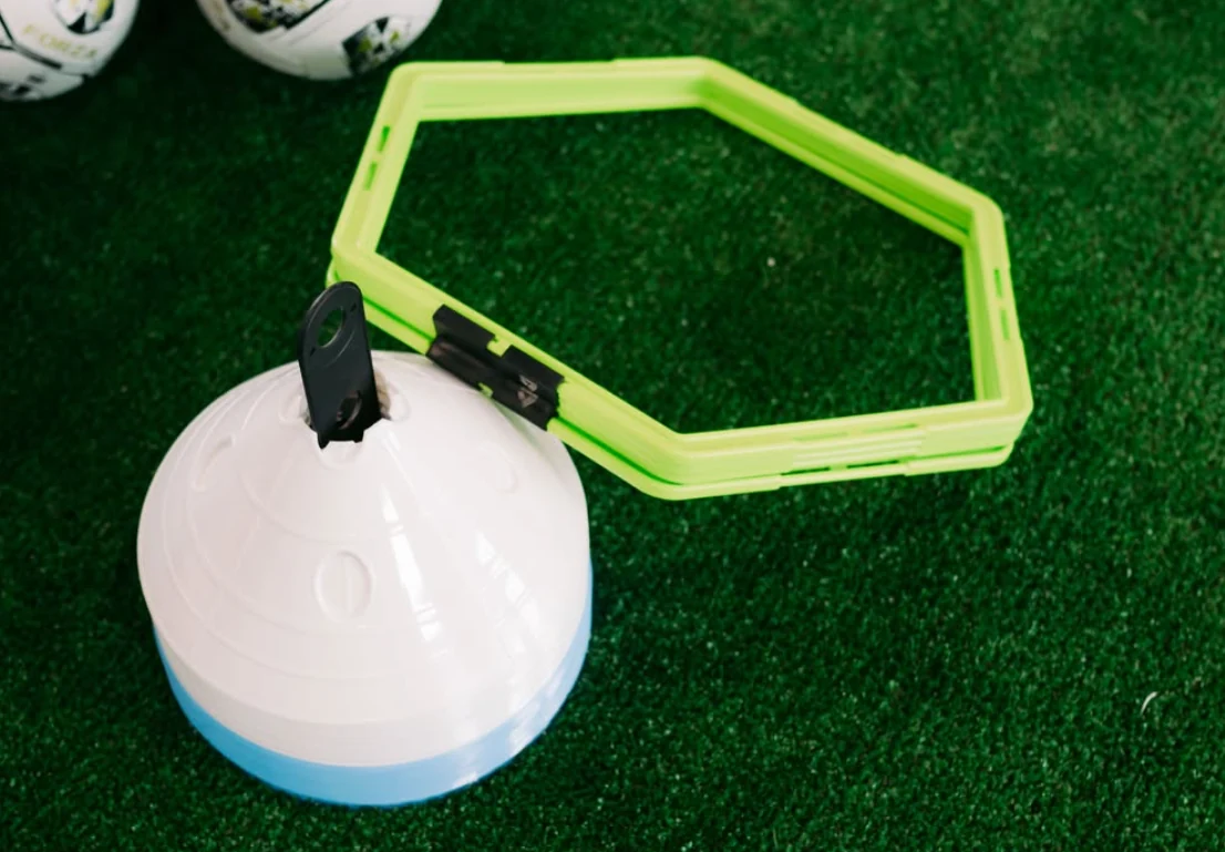 Training cone and agility hexagon on THE90’s turf