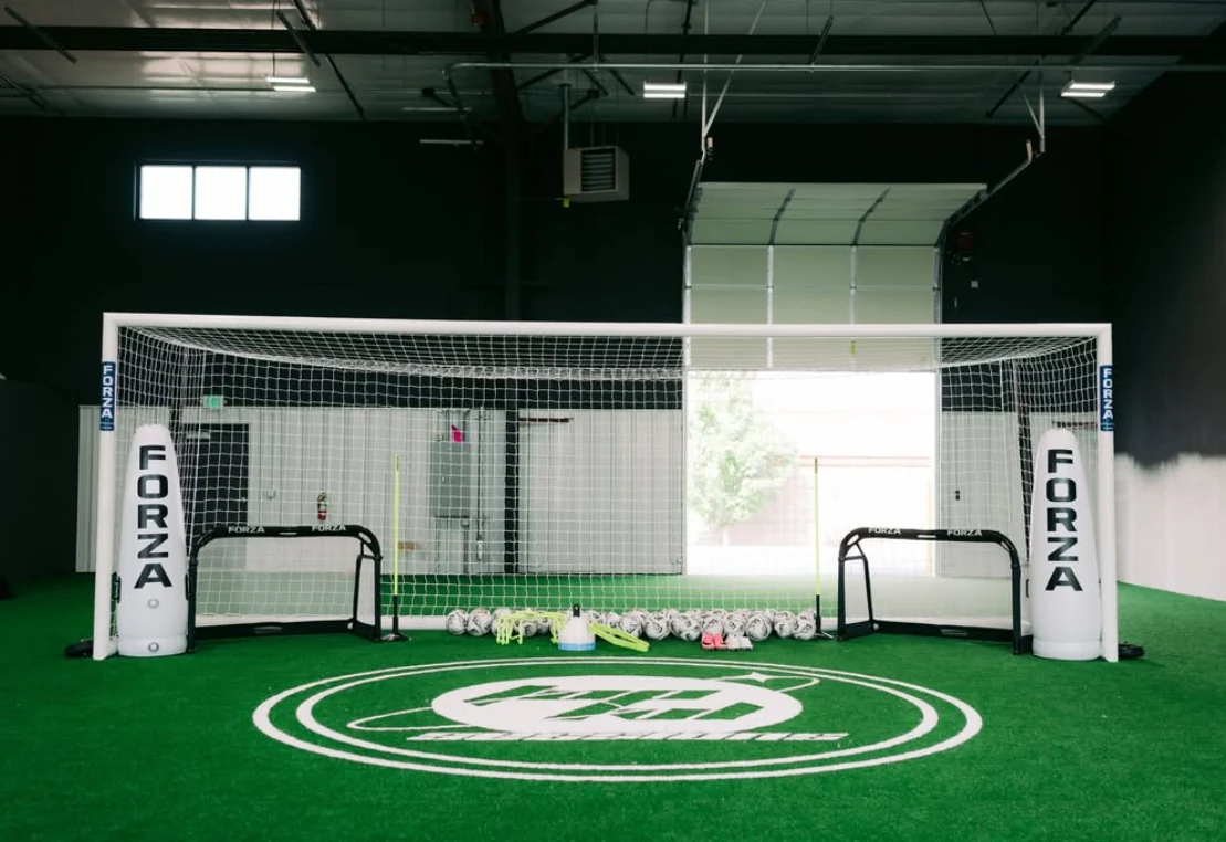 Full-size goal, two small Forza goals and the THE90 center mark on the indoor field